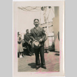 Man standing on deck of ship (ddr-densho-426-1990)
