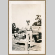 Soldier poses in front of car (ddr-densho-368-502)