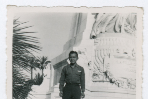 Soldier standing in front of statue (ddr-densho-368-163)