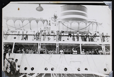 Passengers throw streamers from a ship (ddr-densho-404-181)