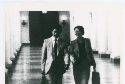 Man and woman walking through a hall (ddr-densho-1007-393)