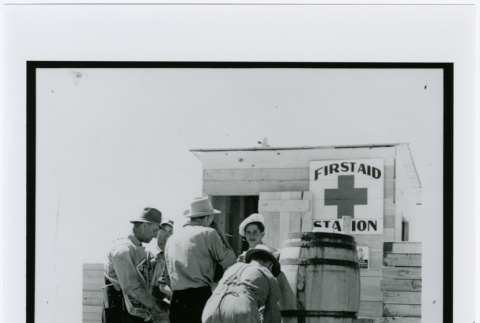 View of Carpenters Getting Drink of Water at Hart (sic) Mountain Relocation Camp, c. 1941 (ddr-densho-122-748)