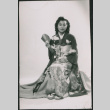 Portrait of woman sitting in kimono holding fan (ddr-densho-523-220)