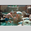 Placing rock into pool (ddr-densho-377-2495)