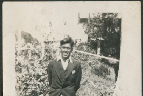 Man standing on sidewalk (ddr-densho-316-283)
