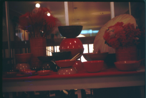 Display of red and black enamelware bowls (ddr-densho-426-316)