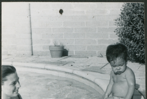 Woman and baby in pool (ddr-densho-523-415)