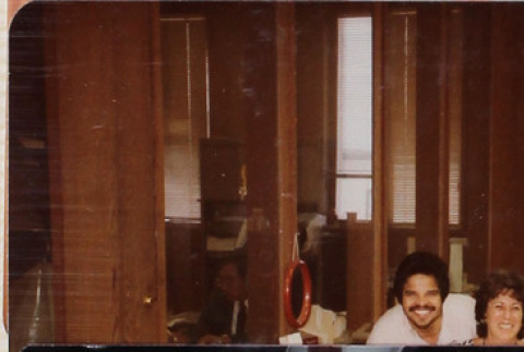 Two people behind desk (ddr-densho-426-1265)