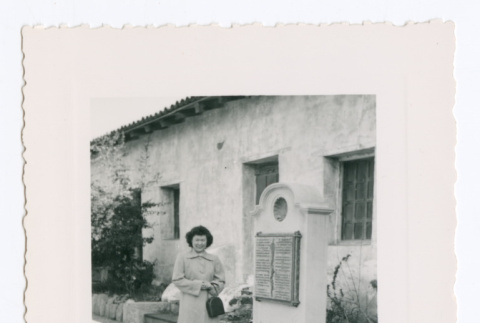 Lillie (Yamato) Komai in front of sign at Carmel Mission (ddr-densho-562-58)