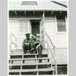 Officer and one other on stoop (ddr-densho-1007-601)
