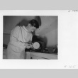 Dr. T. Uchida polishing false-teeth (ddr-fom-1-869)