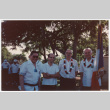Men with flag in veterans parade (ddr-densho-368-410)