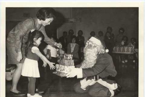 Santa giving a little girl presents (ddr-jamsj-1-574)