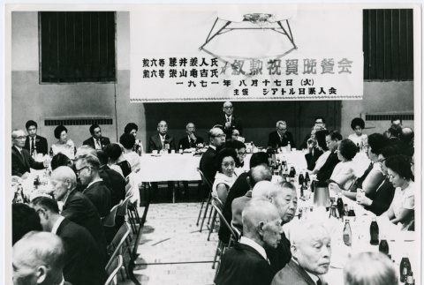 Photo of group seated at tables (ddr-densho-355-45)