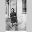Laughing girl standing on sidewalk (ddr-ajah-6-819)