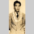 Young man wearing leis (ddr-njpa-4-2342)