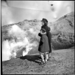 Woman and two children overlooking volcano (ddr-densho-426-285)