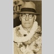 A man wearing leis (ddr-njpa-1-972)