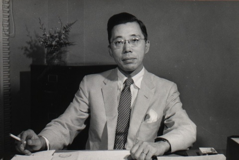 Masahide Kanayama at his desk (ddr-njpa-4-625)