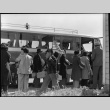 Japanese Americans boarding bus (ddr-densho-151-146)