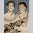Two men wearing leis and playing a ukelele (ddr-njpa-1-487)