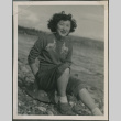 A woman sitting on the beach (ddr-densho-201-892)