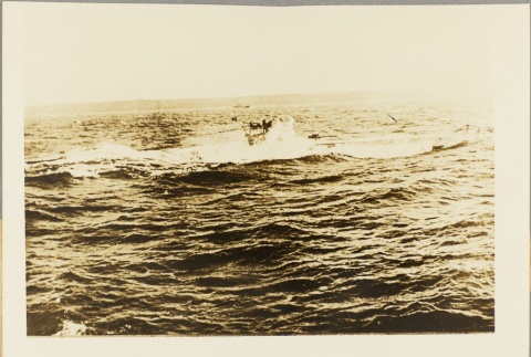 Photograph of a U-boat breaking the surface (ddr-njpa-13-997)