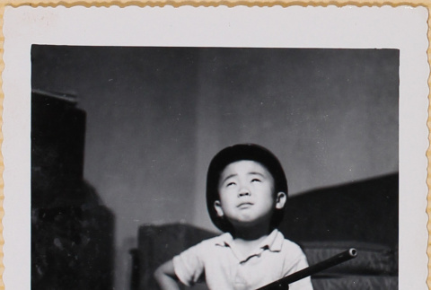 William Shiomi with toy rifle (ddr-densho-522-187)