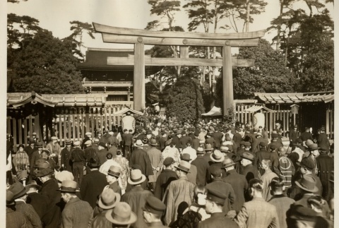 A large crowd walking through the entrance of a shrine (ddr-njpa-8-48)