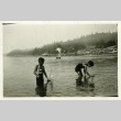 Children playing in water with sailboats (ddr-densho-182-85)