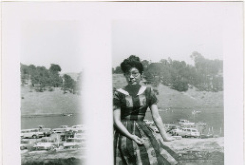 Tomoye (Nozawa) Takahashi sitting on log (ddr-densho-426-2199)