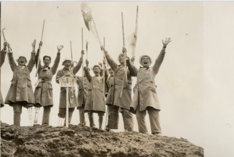 Wounded soldiers celebrating at the top of a hill (ddr-njpa-6-32)