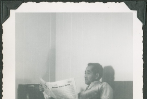 A man reading a newspaper (ddr-densho-328-372)