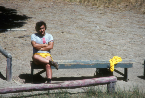 Ted Hasegawa sitting on a bench on the waterfront (ddr-densho-336-1125)