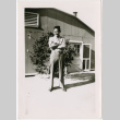 Masao Tsukada standing outside barracks (ddr-densho-356-1076)