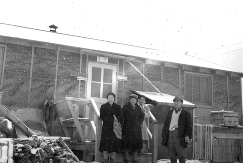 The Suzuki family in front of their barracks room at Minidoka concentration camp, Idaho (ddr-densho-243-6)