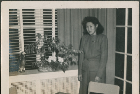 Woman standing by arrangement (ddr-densho-316-420)