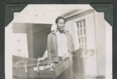 Man standing near dog (ddr-densho-540-52)