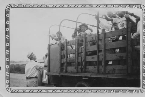 Japanese Americans on an army truck (ddr-densho-187-4)