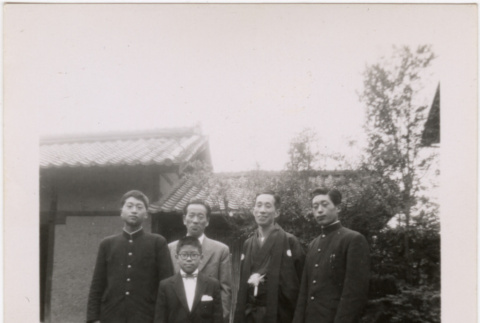 Four men and a boy standing outside house (ddr-densho-426-49)