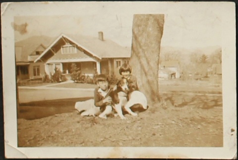 Nisei brother and sister with dog (ddr-densho-259-224)