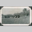 Photo of people lying on a grassy hill (ddr-densho-483-1357)
