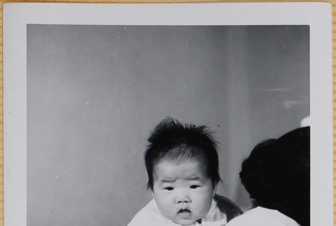 woman holding Leslie Shiomi (ddr-densho-522-356)