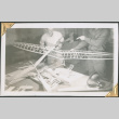 Two men working on model glider (ddr-densho-434-139)