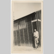 Man standing in front of barracks in Block 1 (ddr-densho-420-19)