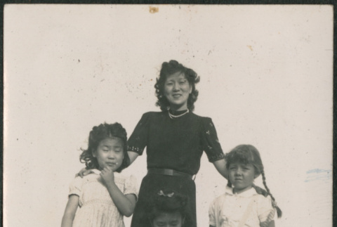 Two woman with two babies and two girls (ddr-densho-316-409)
