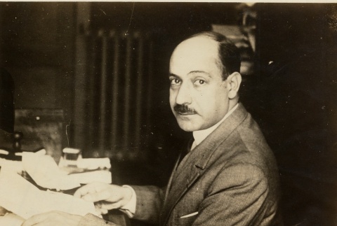 A man seated at his desk (ddr-njpa-1-2331)