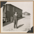 Woman outside barracks (ddr-densho-542-240)