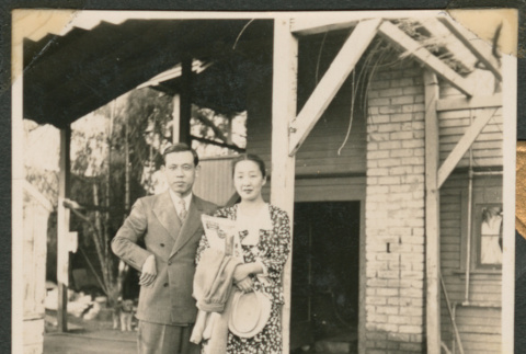 Couple standing under an awning (ddr-densho-433-775)