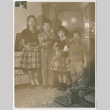Four children holding Christmas ornaments (ddr-densho-338-76)